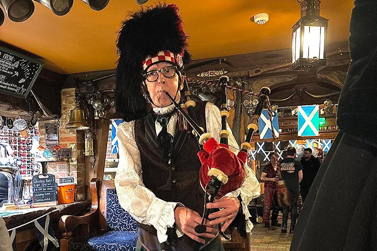 Bagpiper performing at The Dairyman's Daughter for Burns Night