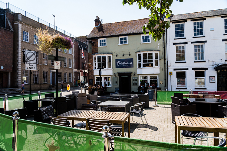 Outside seating in the square at The Wheatsheaf in Newport, Isle of Wight